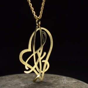 Pendentif or initiales C et F